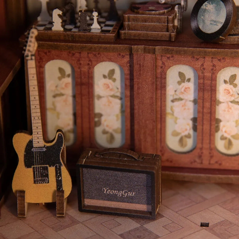 Booknook - The Secret Rhythm, un kit créatif pour construire un diorama miniature. Parfait pour décorer une bibliothèque ou comme cadeau original pour un amoureux des livres. Par Nookette.